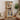 Wooden bookshelf with decorative items in a living room setting
