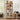 Wooden bookshelf with decorative items in a home office setting