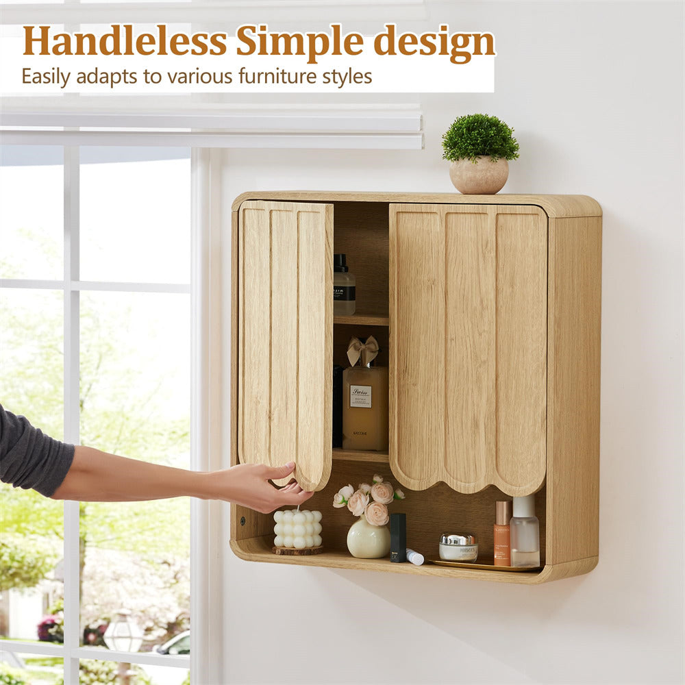 Wooden wall-mounted cabinet with a hand reaching out to open it, on a white wall background.