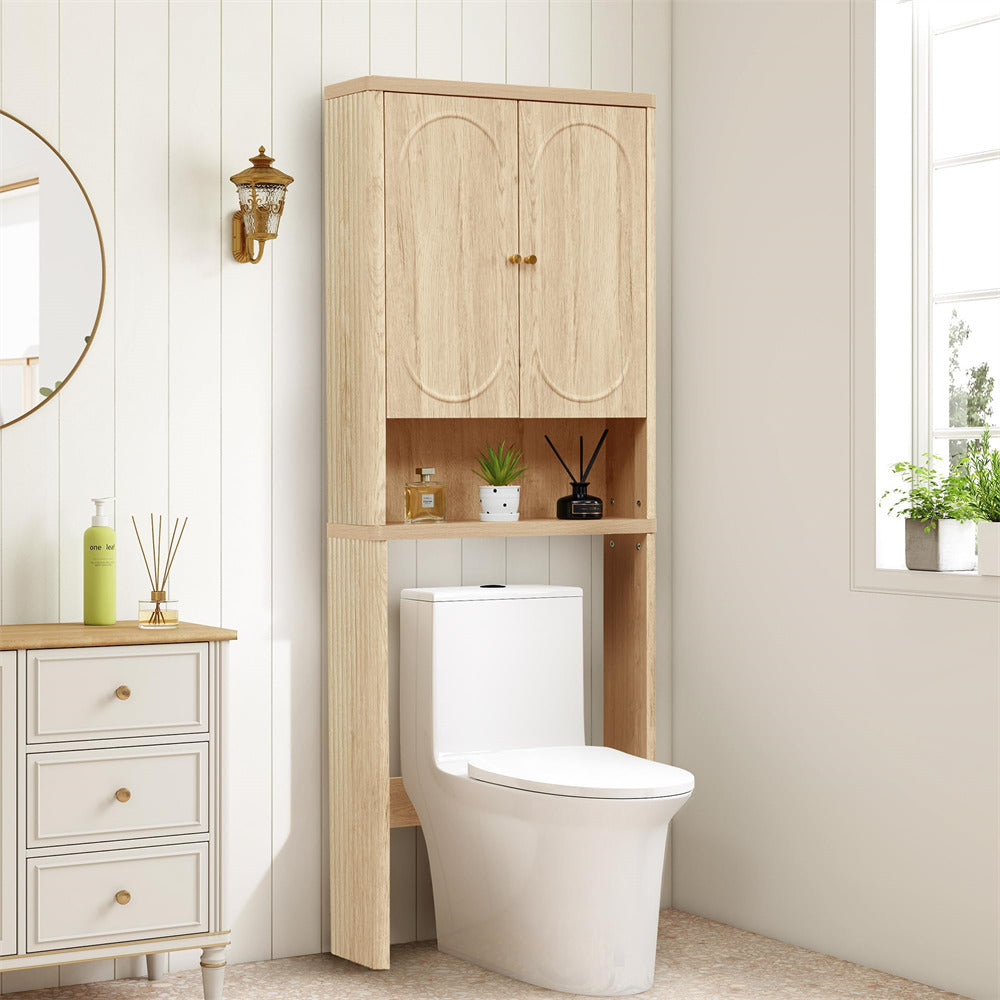 Bathroom with a wooden over-the-toilet cabinet and white toilet.