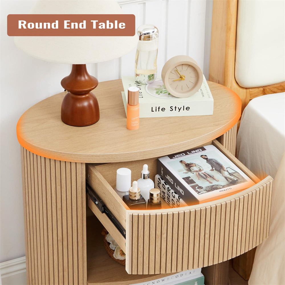 Round end table with a drawer, decorative items, and a book titled 'Life Style'.
