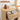Round end table with a drawer, decorative items, and a book titled 'Life Style'.