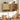 A light natural wood wall-mounted kitchen cabinet with scalloped doors, shown open with shelves and spice jars inside, set against a white paneled wall in a styled kitchen scene.