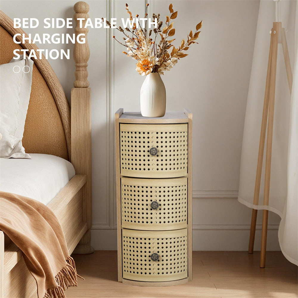 Bedside table with charging station next to a bed in a bedroom setting