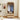 Wooden wardrobe with clothes inside in a room with a painting on the wall.