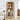 Wooden bookshelf with decorative items in a living room setting