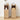 Two light oak wood nightstands with two drawers and open shelving, styled with home decor items against a white wall and light wood floor.