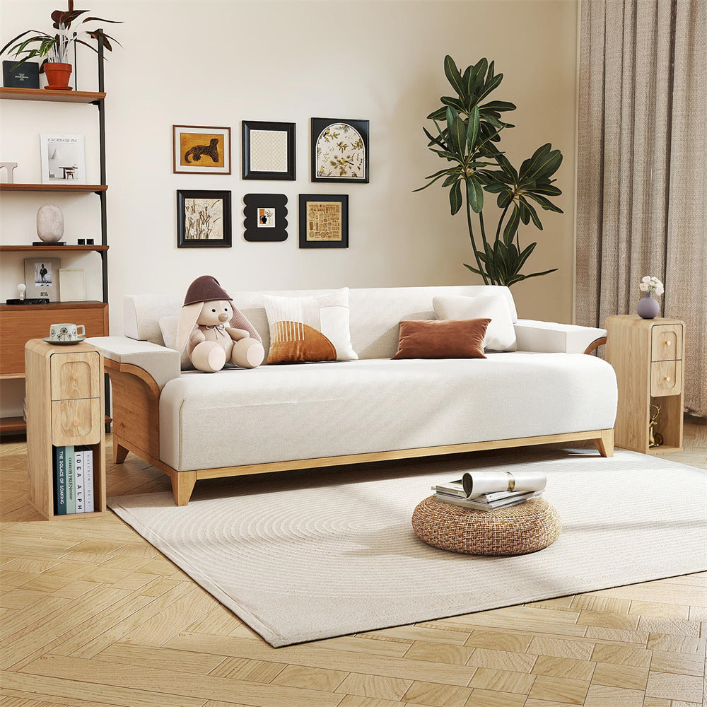 Modern living room with a white sofa, wooden coffee table, and decorative elements.