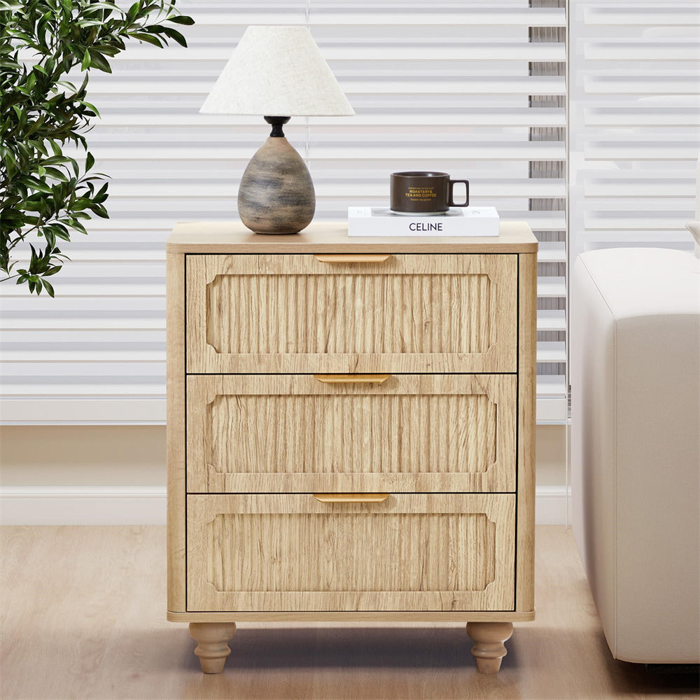 Wooden nightstand with two drawers, lamp, and mug in a room setting.