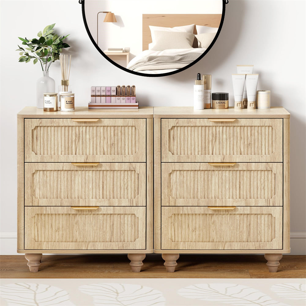Light wood dresser with decorative items on top in a bedroom setting
