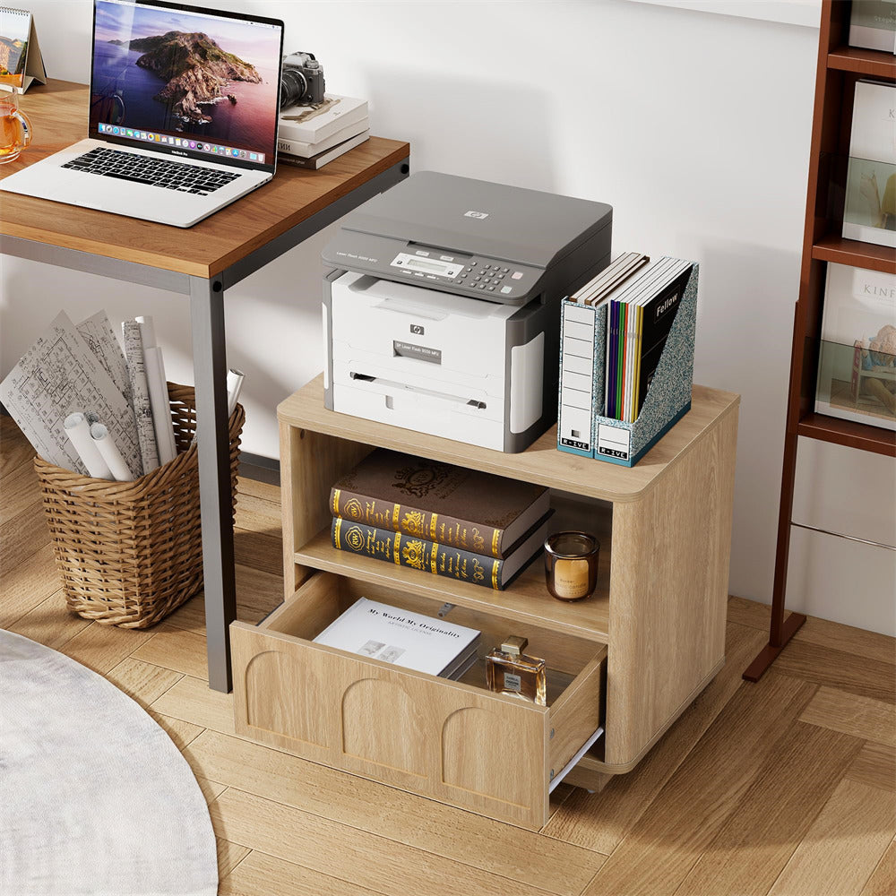 Wooden desk with laptop, printer, and books in a home office setting