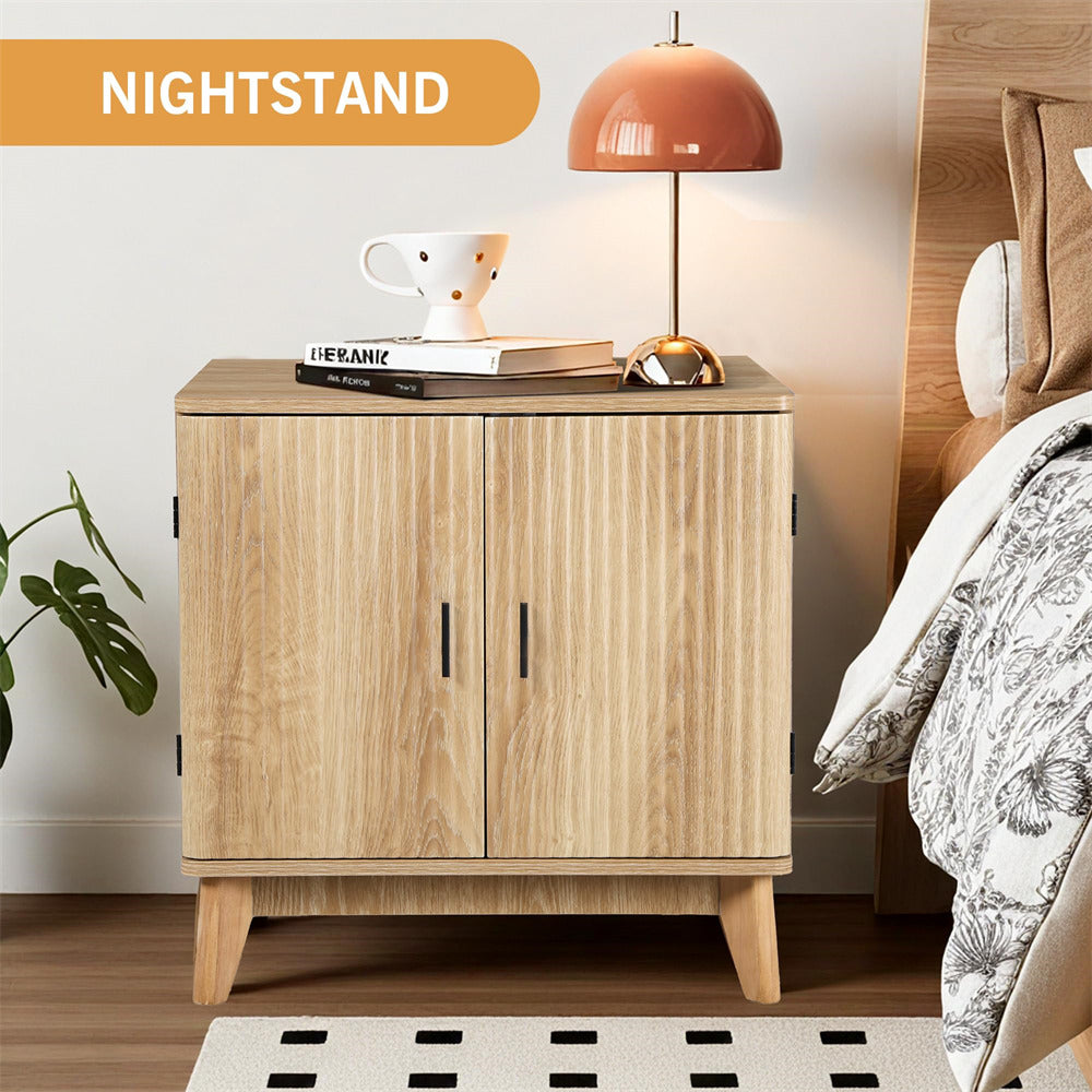 Wooden nightstand with a lamp and books in a bedroom setting