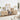 Wooden entertainment console in a living room setting with decor items.
