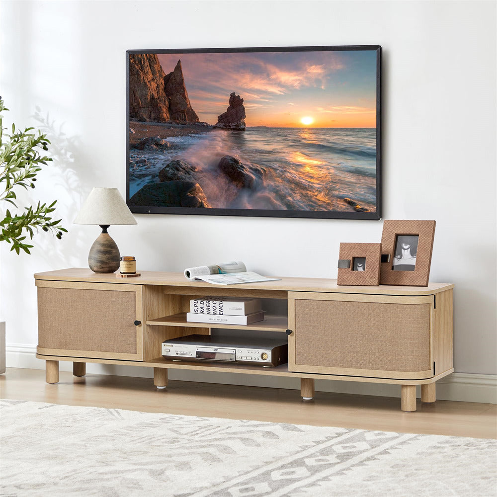 Wooden TV stand with a television displaying a sunset over water scene, in a living room setting.