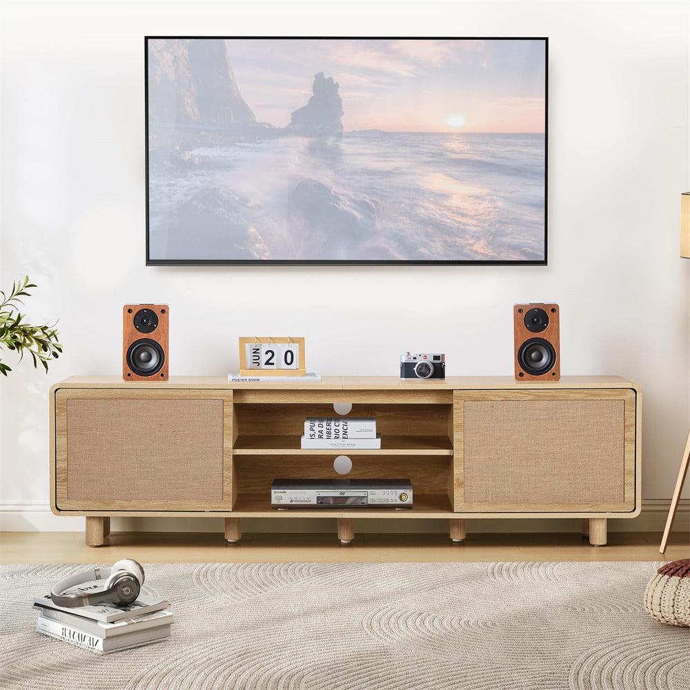 Wooden TV stand with speakers and a framed picture in a living room setting.