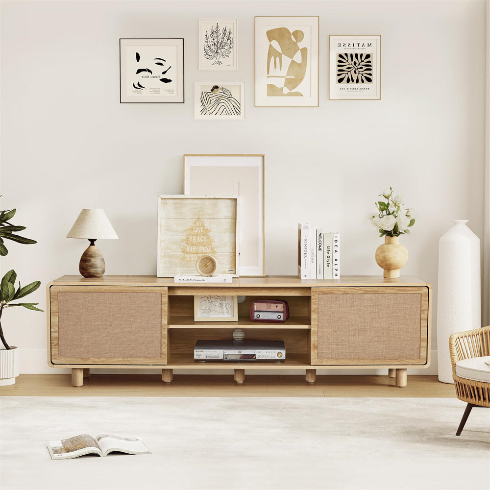 Wooden entertainment console with decorative items in a living room setting
