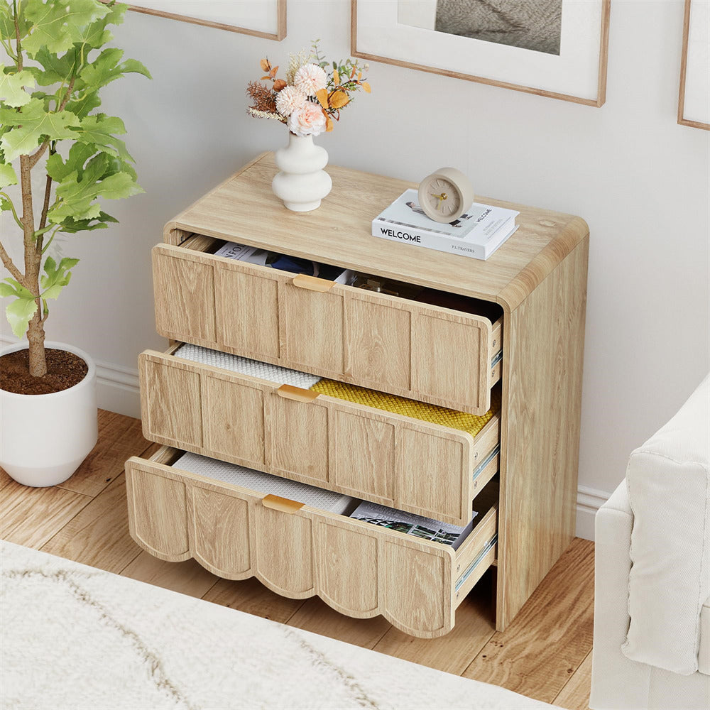 Wooden dresser with open drawers in a room setting with decor elements.