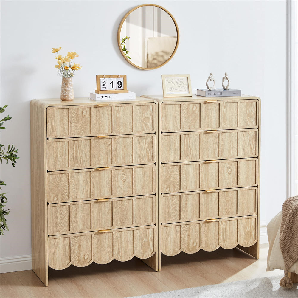 Wooden 5 drawer dresser with decorative items in a room setting