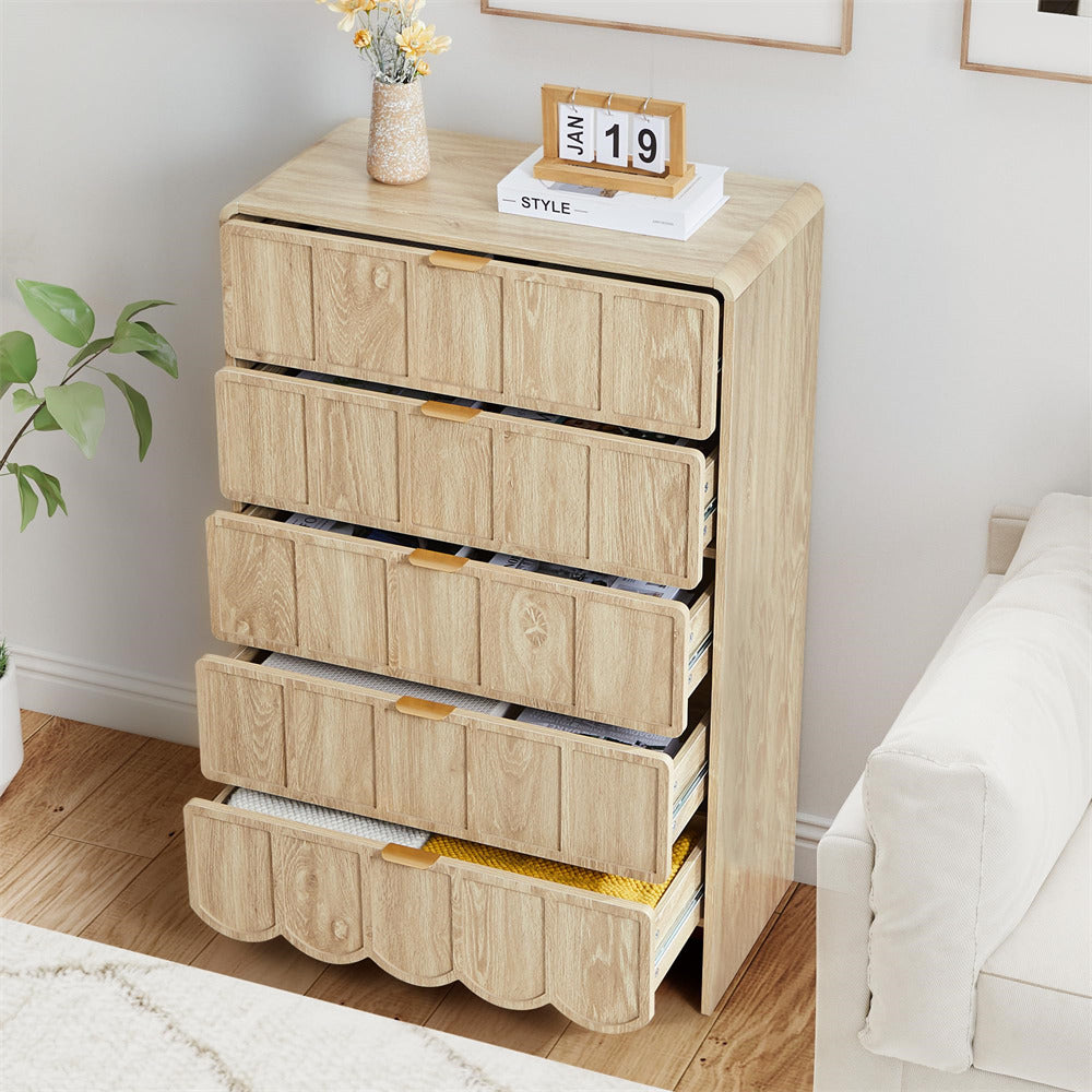 Wooden 5 drawer dresser with four drawers in a bedroom setting.