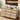 Wooden storage cabinet with multiple drawers in a room setting, emphasizing large storage capacity.
