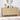 Wooden dresser with decorative items in a room setting