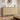 Wooden dresser with decorative items in a bedroom setting