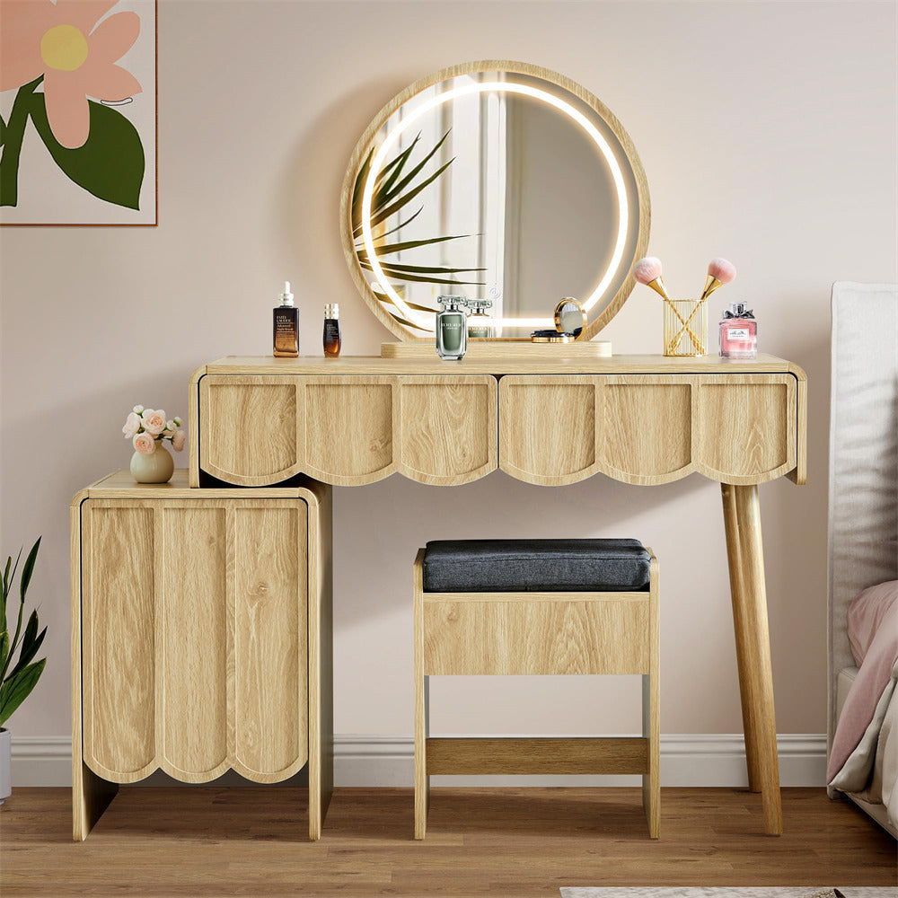 Wooden vanity table with round mirror and stool in a room setting