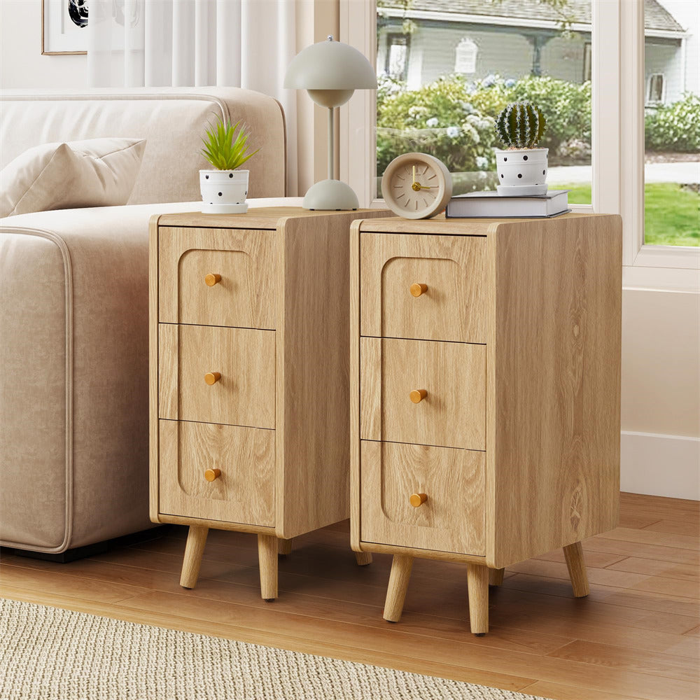 Wooden side tables with drawers in a living room setting.