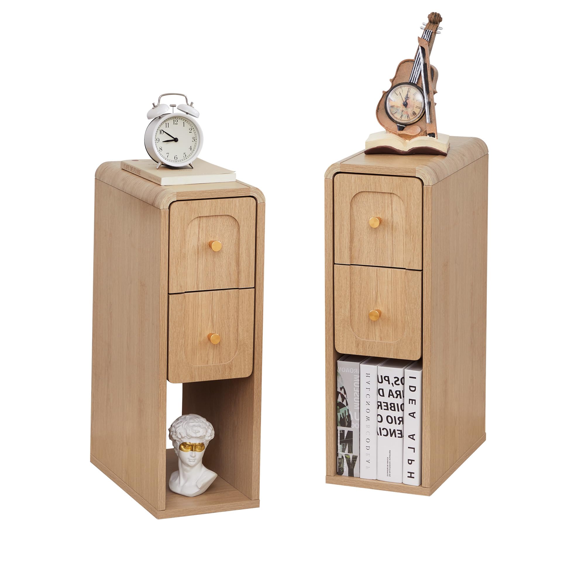 Two light oak wood nightstands shown on a white background, each with two drawers, round knobs, and open shelving. The left nightstand holds an alarm clock and a small bust; the right nightstand holds a violin-shaped clock and books.
