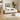 A modern light wood daybed with a white upholstered seat, styled in a warm, minimalist living room with a beige rug, wooden side tables, and framed wall art.