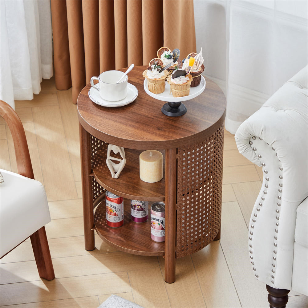 Wooden side table with a cup, saucer, and small cake stand in a living room setting.
