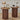 Two wooden side tables with decorative items on a wooden floor.