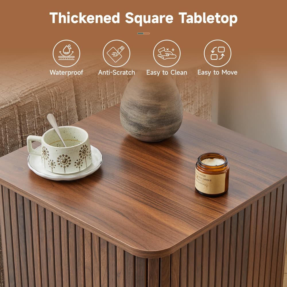 A thickened square wooden tabletop in a warm medium brown finish, shown styled with a ceramic cup and saucer, a vase, and a candle jar. The image includes marketing text at the top reading 'Thickened Square Tabletop' with feature icons for waterproof, anti-scratch, easy to clean, and easy to move.