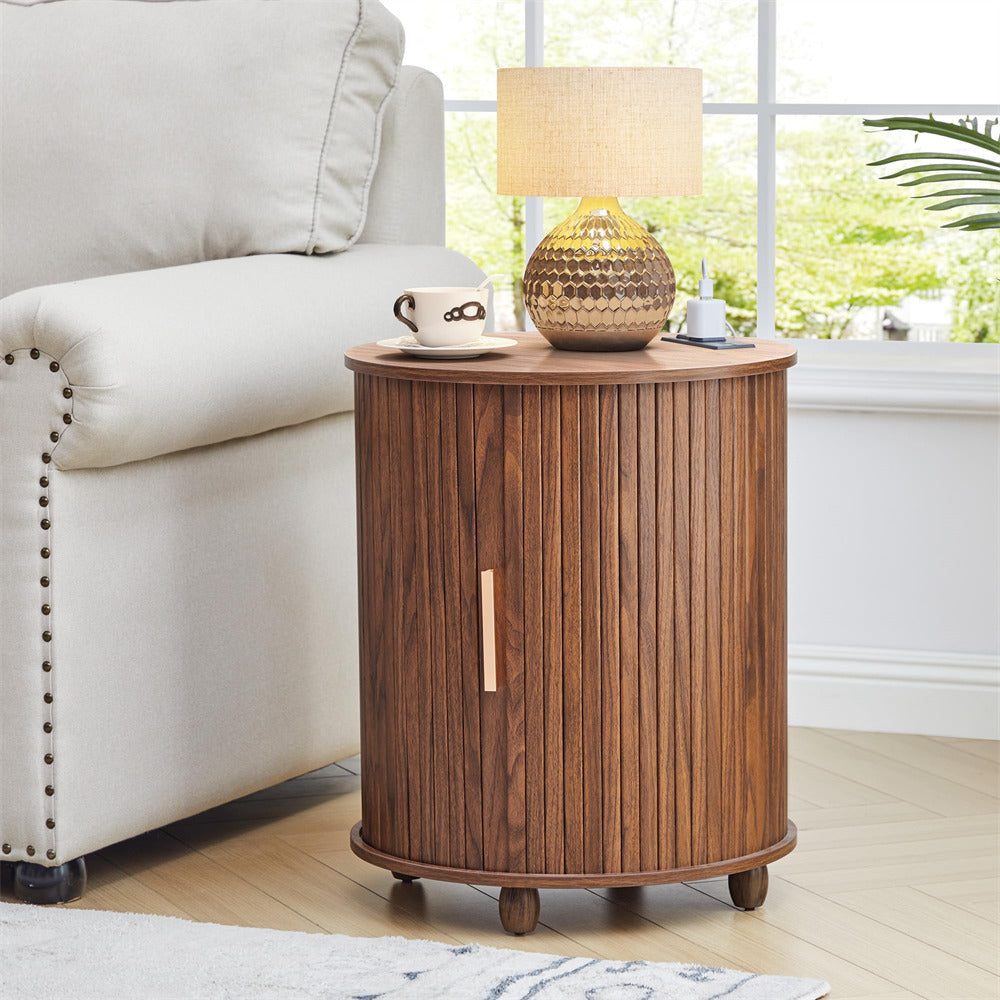 Wooden side table with lamp and cup in a living room setting