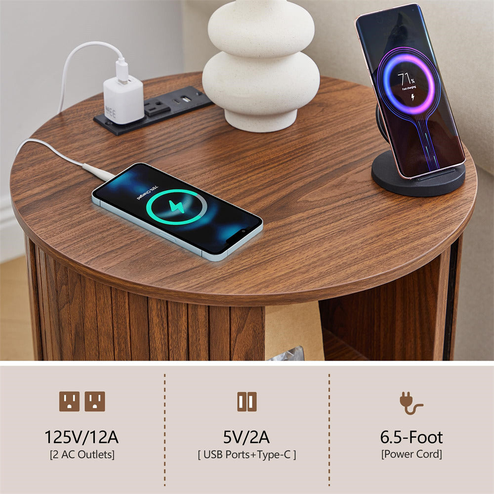 Two smartphones charging on a wooden table with a power adapter and socket.