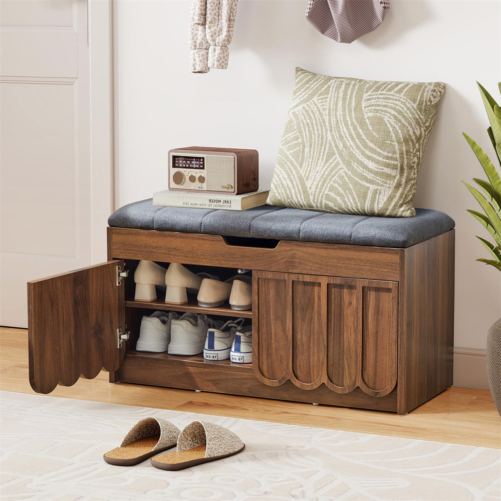 Wooden shoe storage bench with cushioned top, open to reveal shoes and a radio, in a home setting.