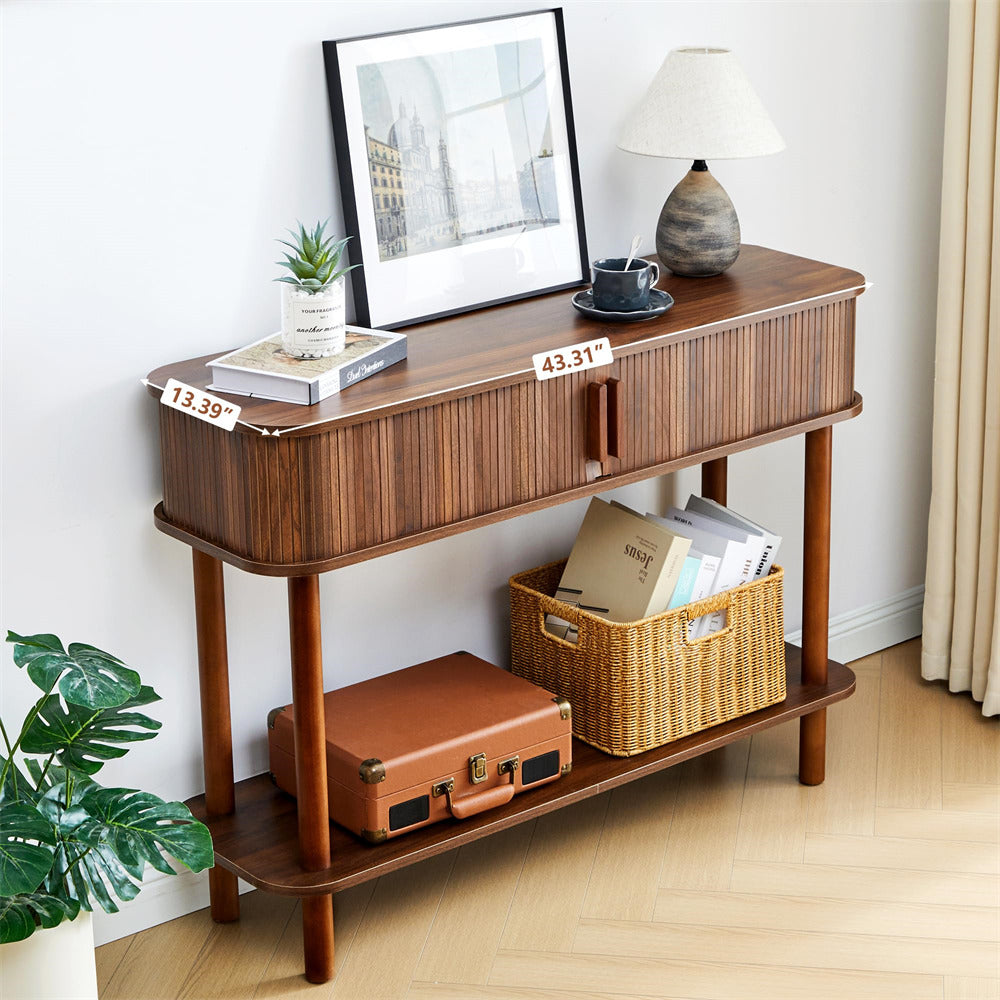 Wooden console table with decor items in a room setting