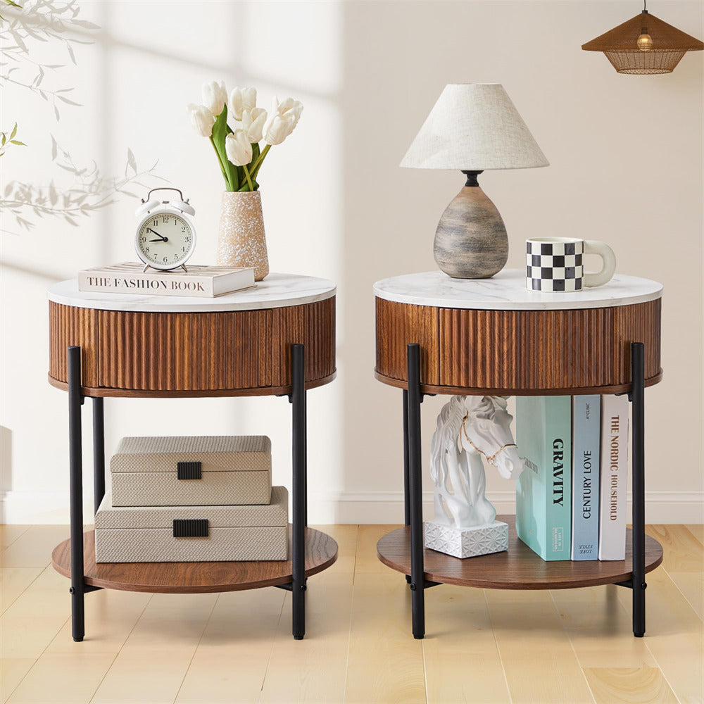 Two round wooden side tables with marble tops in a living room setting.