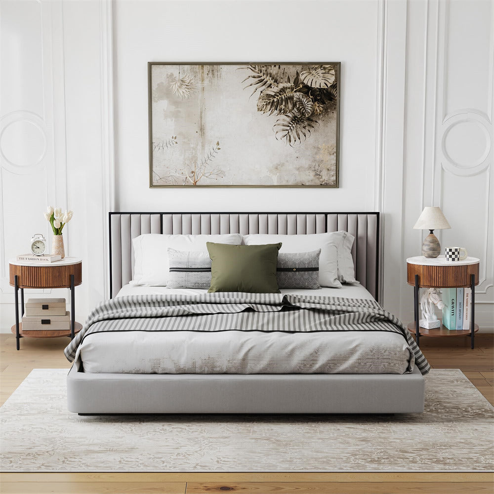 Modern bedroom with a bed, side tables, and decorative elements.