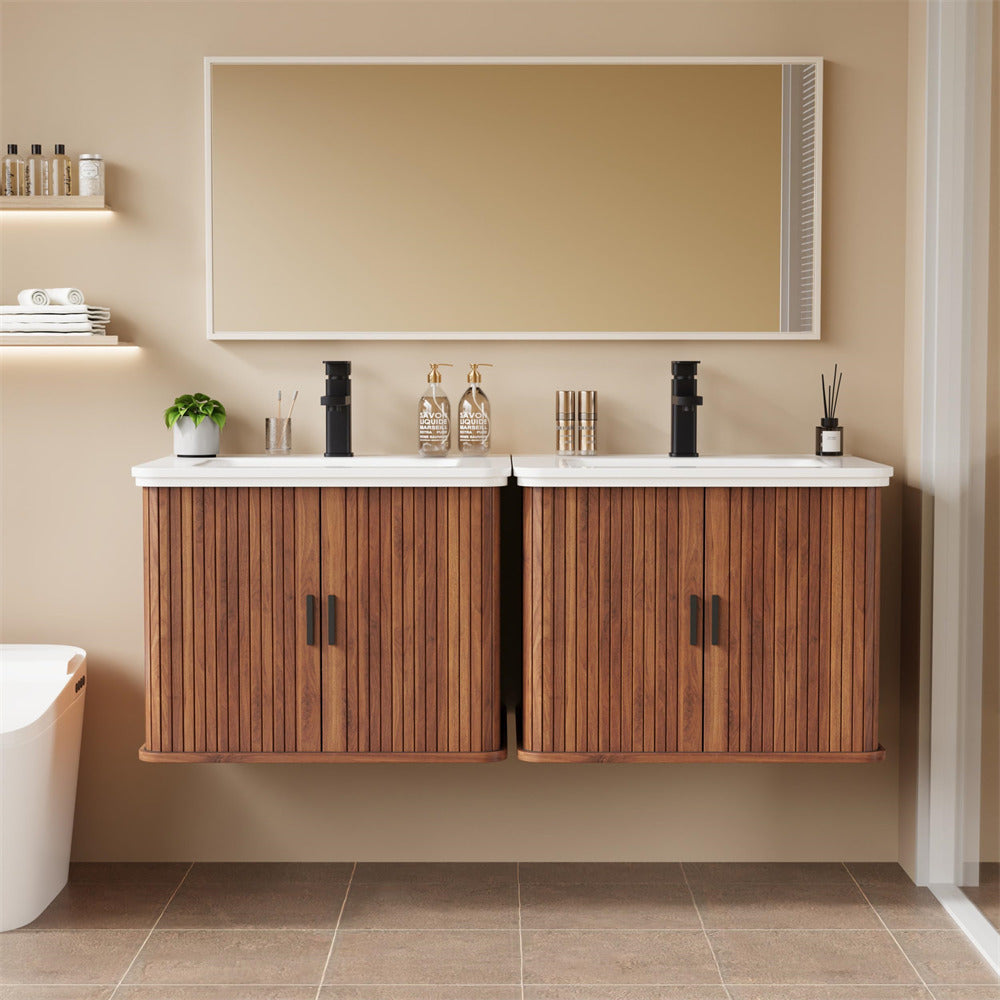 Bathroom vanity with wooden cabinets, white countertop, and decorative items.