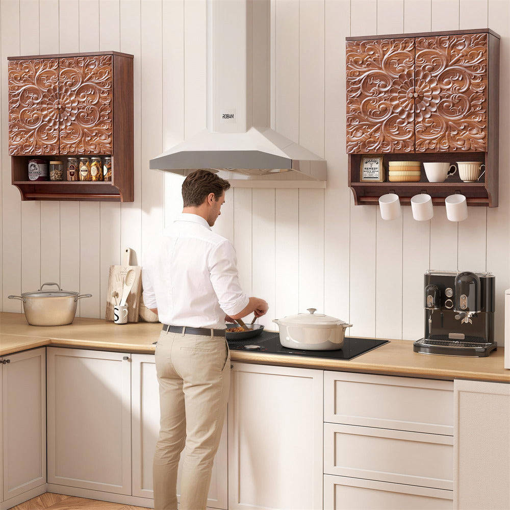 Man cooking in a modern kitchen with decorative wall panels and wooden cabinets.