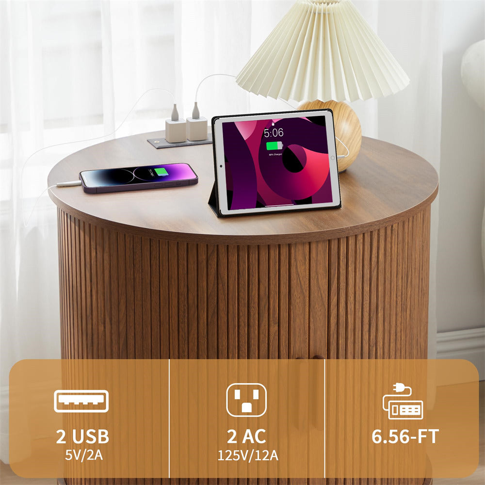 Round wooden side table with electronic devices and power outlets, featuring a tablet and smartphone.