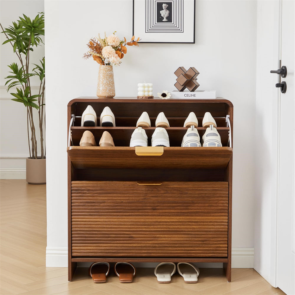 Wooden shoe cabinet with shoes on a wooden floor in a room.