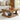 Wooden coffee table with decorative items in a living room setting