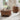 Wooden coffee table and side table in a living room setting with decor items.