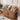 Wooden pet furniture with pet supplies on a wooden floor.