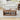 Wooden coffee table with decorative items in a living room setting