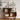 Wooden shelf with books, a calendar, and decorative items against a white wall.