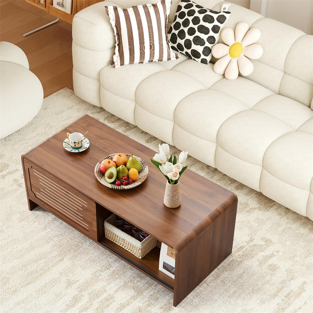Wooden coffee table with fruit and tea set in a living room setting
