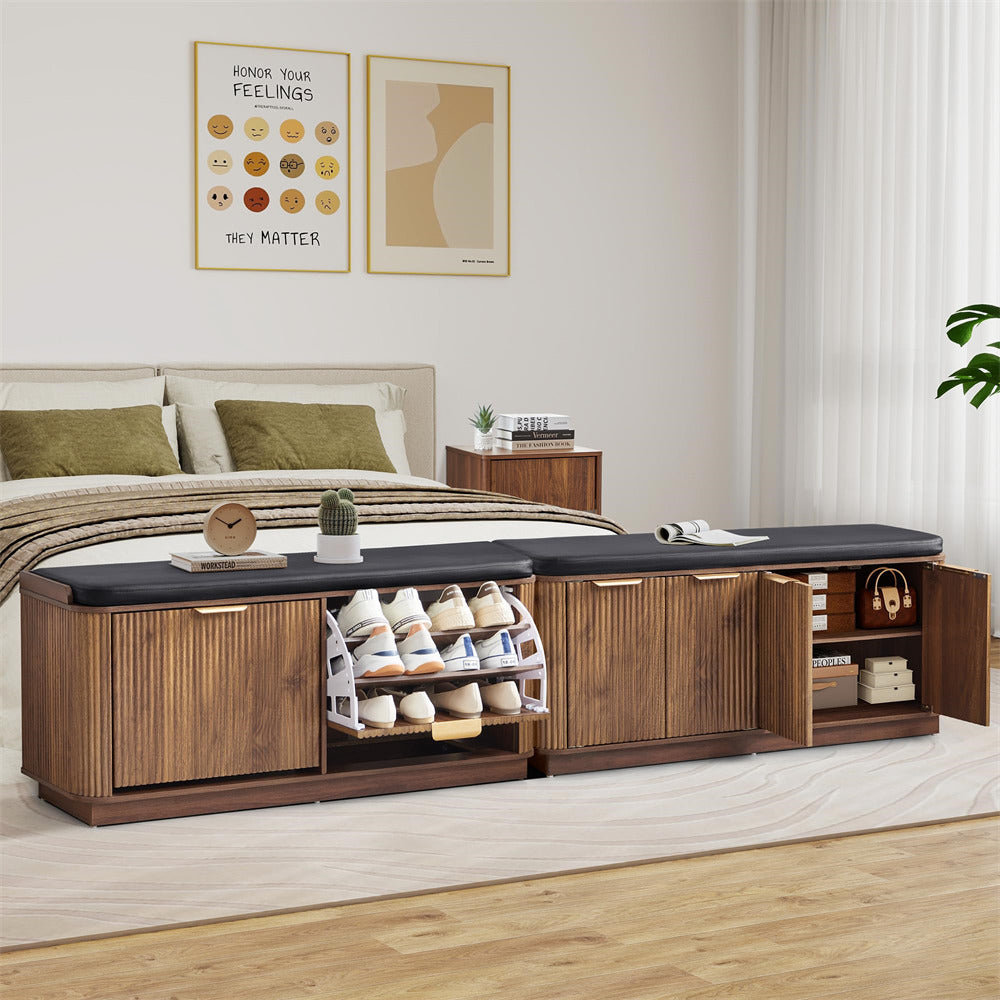 Wooden shoe storage bench in a bedroom with open doors revealing shoes and storage compartments.